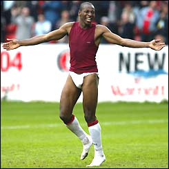 Fulham midfielder Luis Boa Morte gives his strip away to the fans