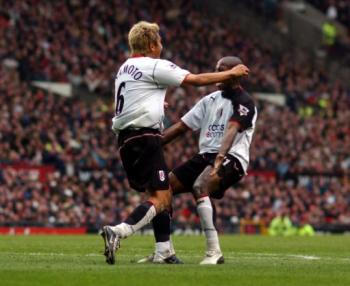 Lee Clark and Louis Saha celebrate a goal a piece