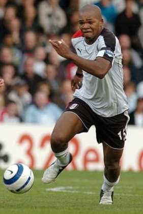 Collins John scores Fulham's only goal at Liverpool