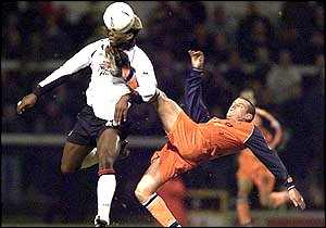 Wycombe defender Vinnicombe breaking Louis Saha's nose